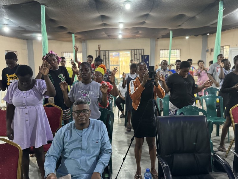 People standing at a worship gathering