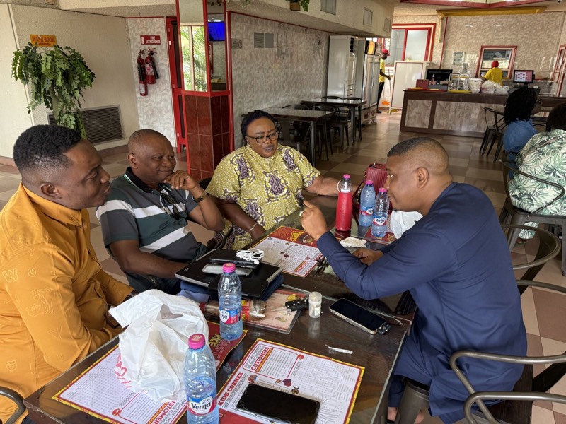 Leaders at a table with papers during a working session