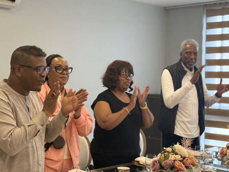 Four leaders standing and applauding