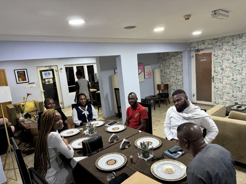 People dining together around a table in a home