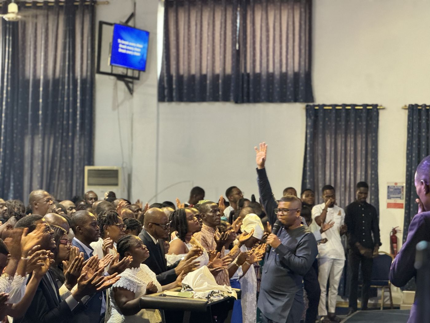 A full auditorium during a fellowship gathering