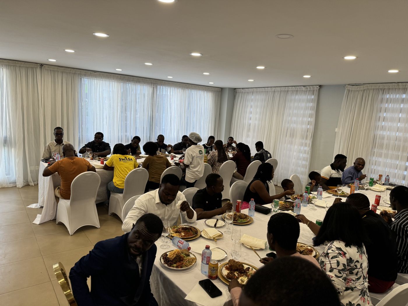 Members seated together at a fellowship gathering